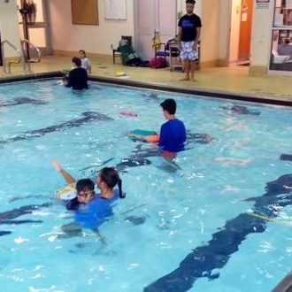Kid swim lessons and programs are offered by Excel Aquatics.
